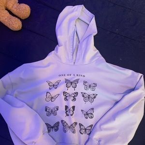 A small hoodie with butterflies on it